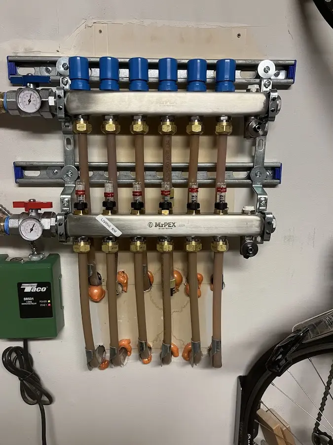 Plumber performing Water Heater Repair at a residential property in East Hampton